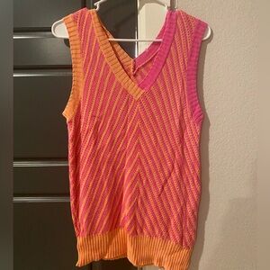 Sweater vest fits like a medium no size tag